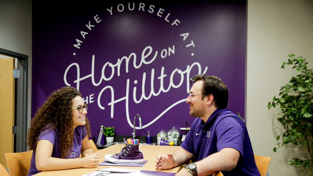 Cornell College admission counselor discusses college applications with student. 