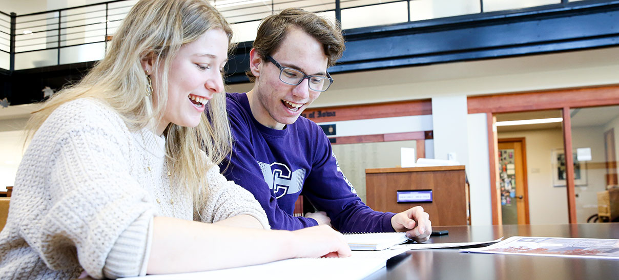 Students working together at a table in Cole Library.