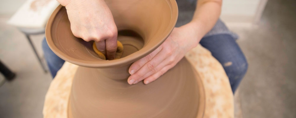 Faculty works on ceramic project