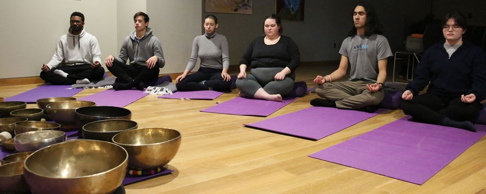Students practicing yoga