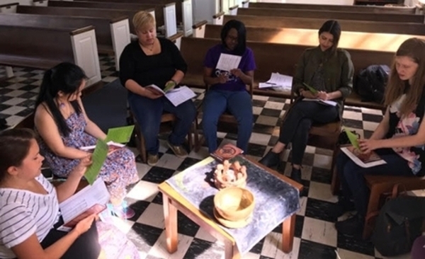 Chaplain and students in Allee Chapel