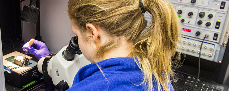 Student analyzes chemistry samples.
