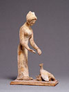 Woman feeding hen