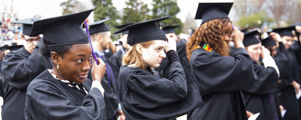 2022 Cornell College Commencement students move their tassels on their graduation caps. 