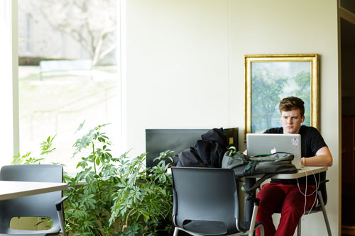 Cornell College computer science student works on a project