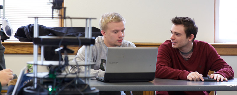 Students collaborate on a robotics project