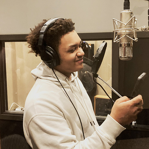 Student in contemporary songwriting recording their song in a Chicago studio