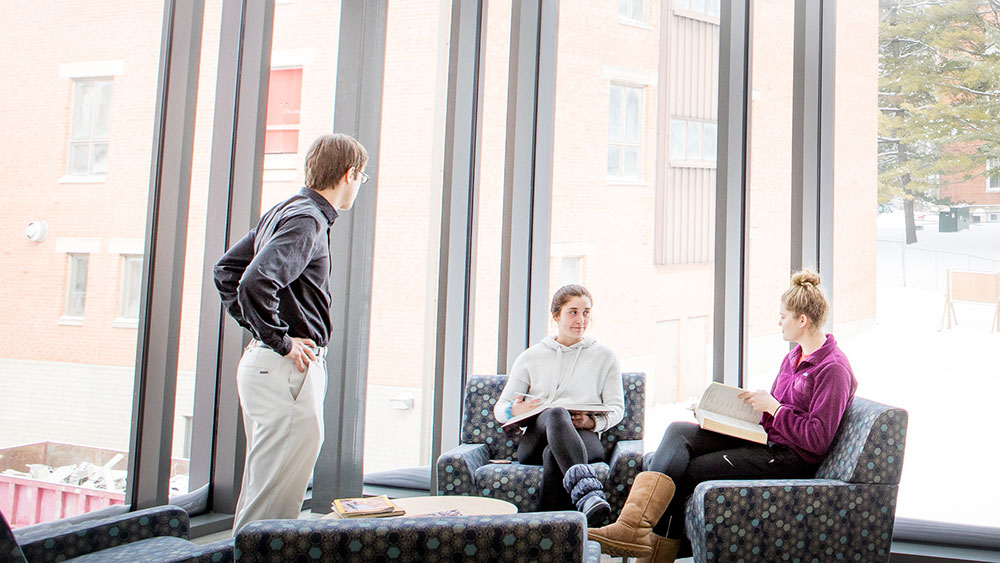 Faculty and students meeting in Russell Science Center
