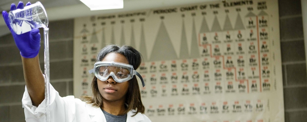 Cornell student works in lab. 