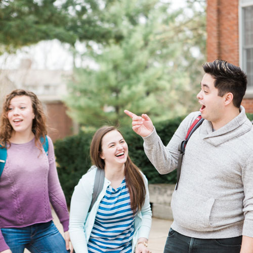 Students laughing together on campus