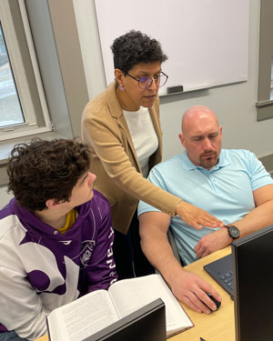 Cornell College students work in the in the Finance Lab under the direction of their professor