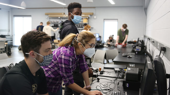 Cornell College engineering students work on a project under the mentorship of engineering faculty
