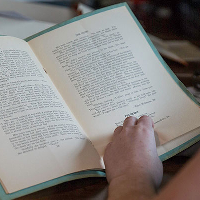 Student reading a manuscript
