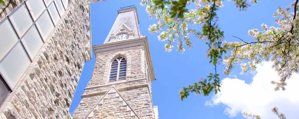 King Chapel tower with the trees in bloom on a sunny day.