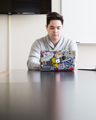 A Cornell College student works on a laptop