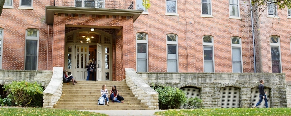 Students outside a campus building on the Cornell College campus.