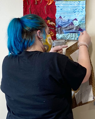 Cornell College art student works on displaying her art