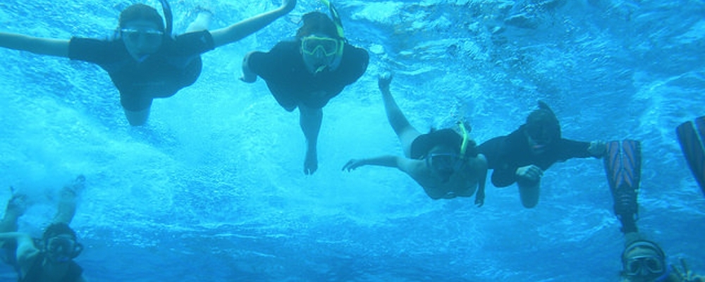 Geology students in the Bahamas scuba diving.