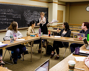 Cornell students in classroom - class sizes max at 25 students