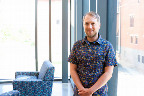 Josh Otten standing in Russell Science Center
