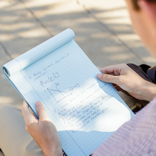 Student with microscope doing biology research