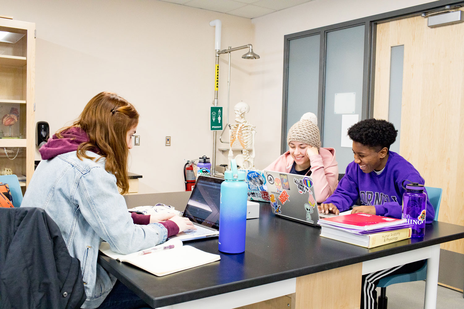 Cornell students work together in the classroom