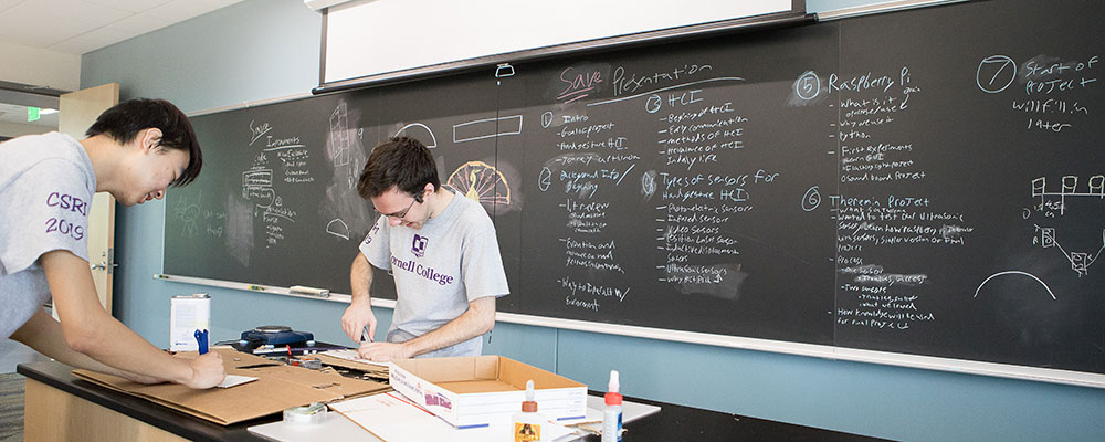 Cornell student examines a fossil