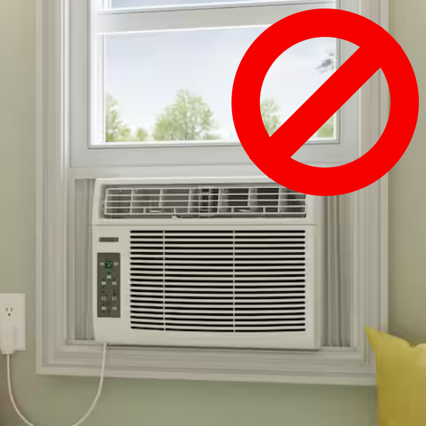 Image of a window-mounted air condition unit which is not allowed to be installed by students.
