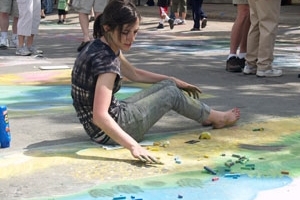 A Cornell student participates in a Mount Vernon Walk the Chalk festival