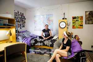 Roommates inside their dorm room 