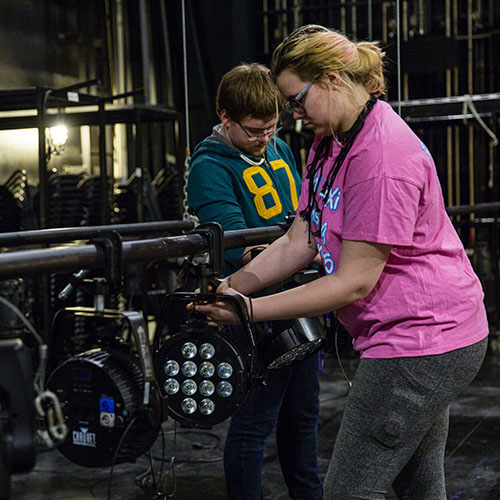 Cornell College students work on a lighting project for a theatre production